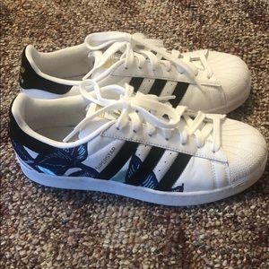 Women’s white adidas shoes with floral pattern